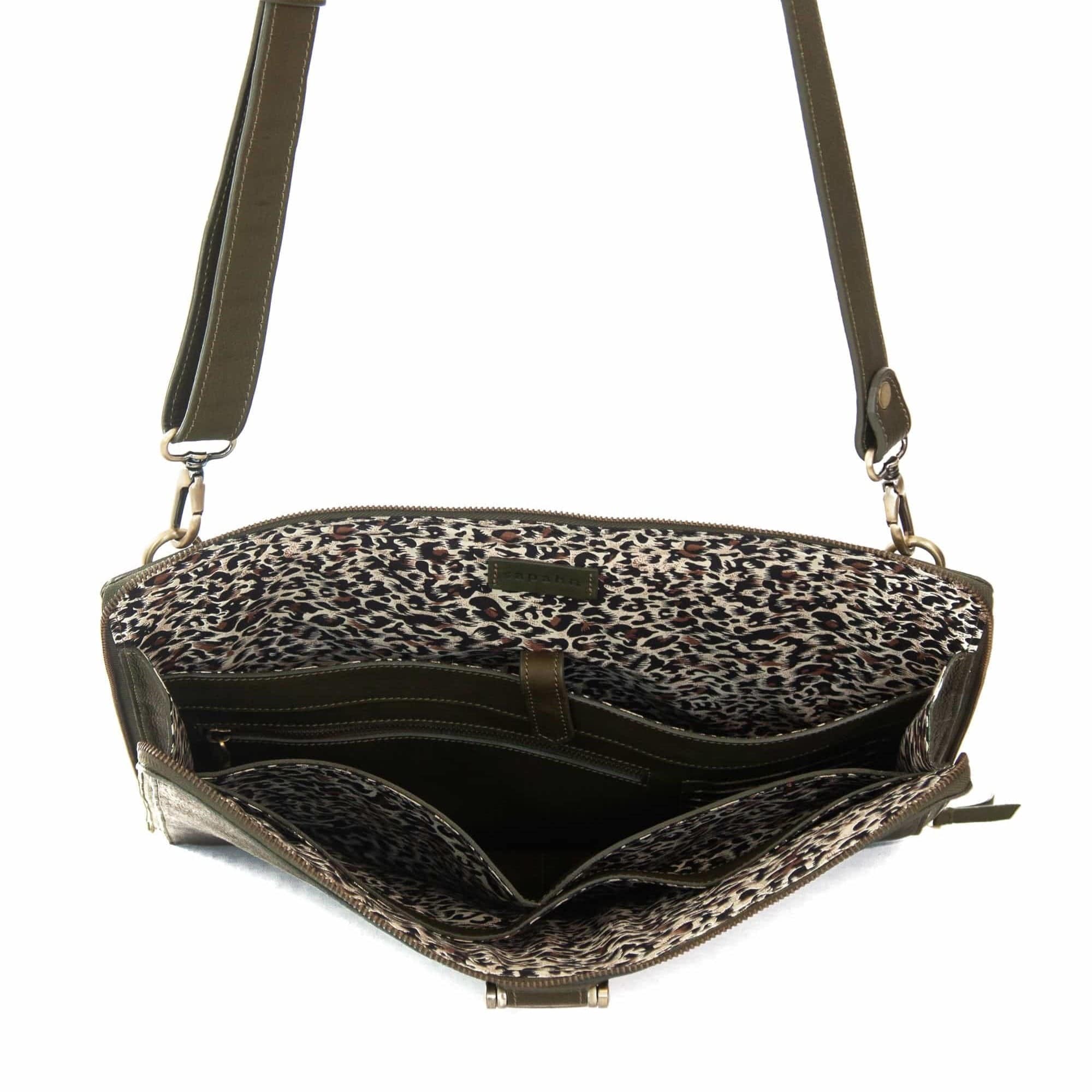 The M large crossbody bag in olive green raw leather will hold your 13” laptop in a scratch-resistant interior sleeve.