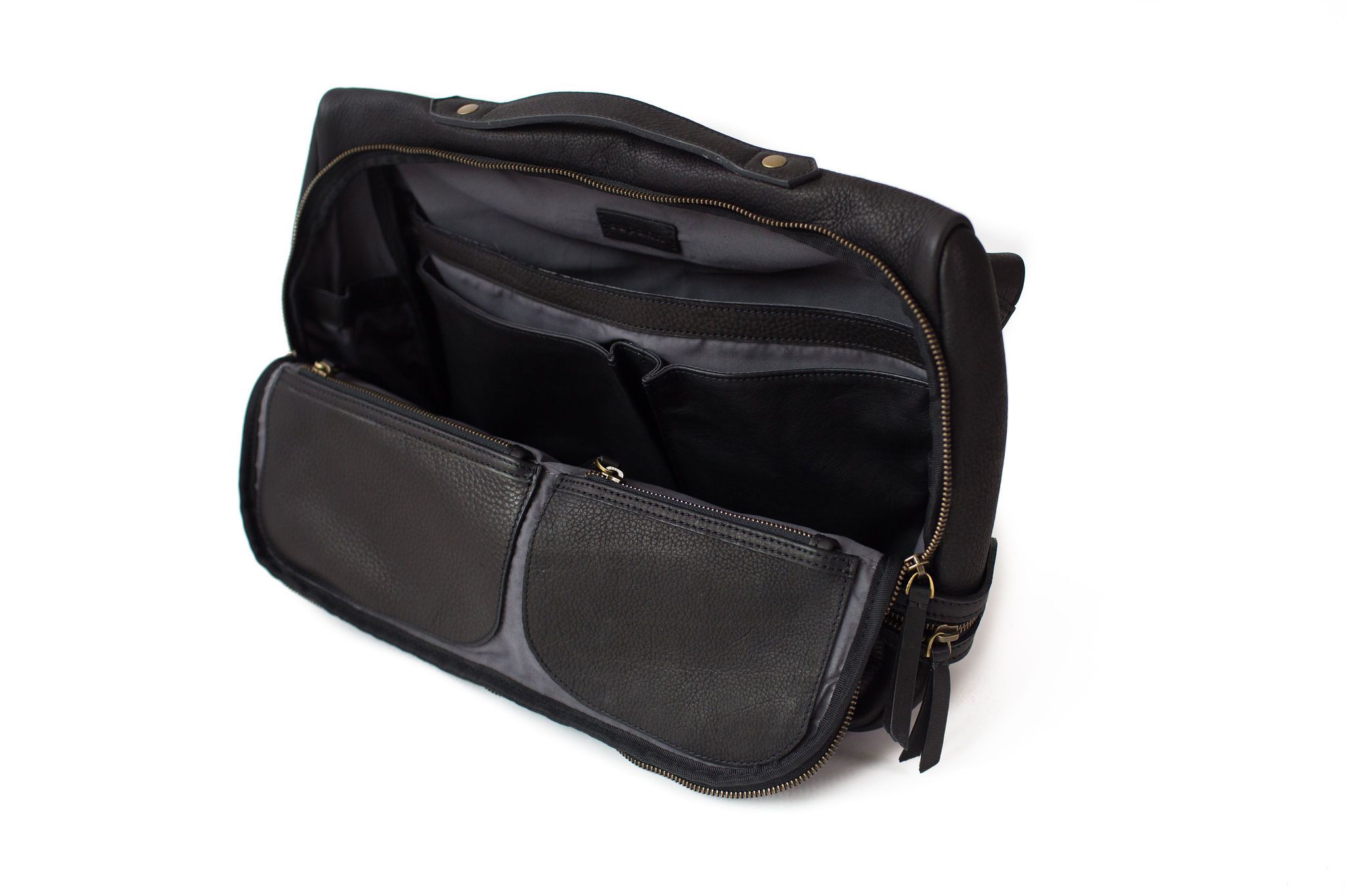 The interior of the Rapinoe unisex messenger bag in black raw leather has many compartments for organization.