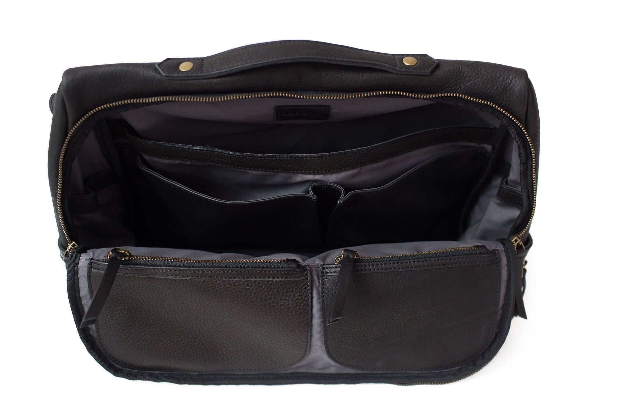 The interior of the Rapinoe unisex messenger bag in black raw leather fits a 15” laptop and much more.