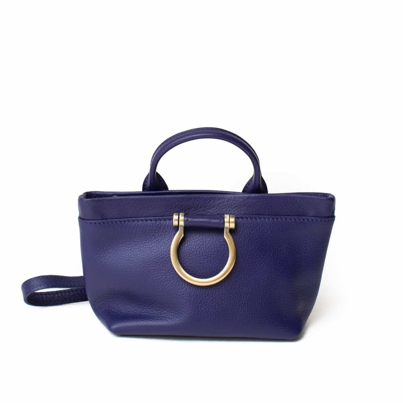 The Roger mini crossbody in admiral blue oil leather features a top handle and Omega plated brass hardware.