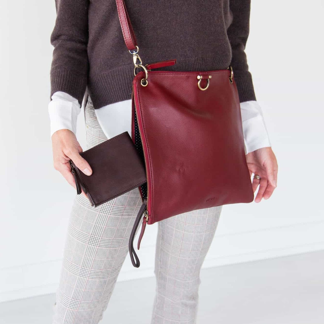 The Noelle billfold wristlet wallet in chocolate brown raw leather fits perfectly in small and medium-sized bags.