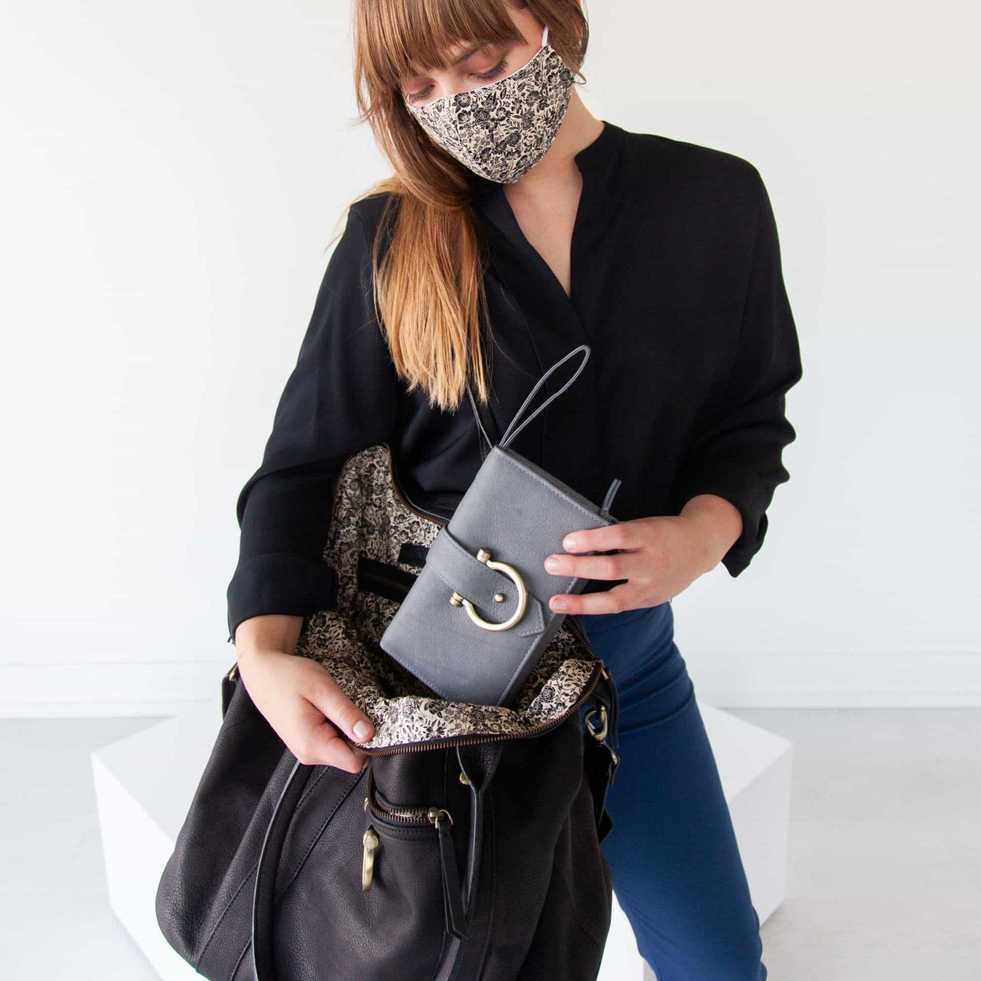 Store all of your must-have belongings in the So Honey weekender tote bag in black raw leather.