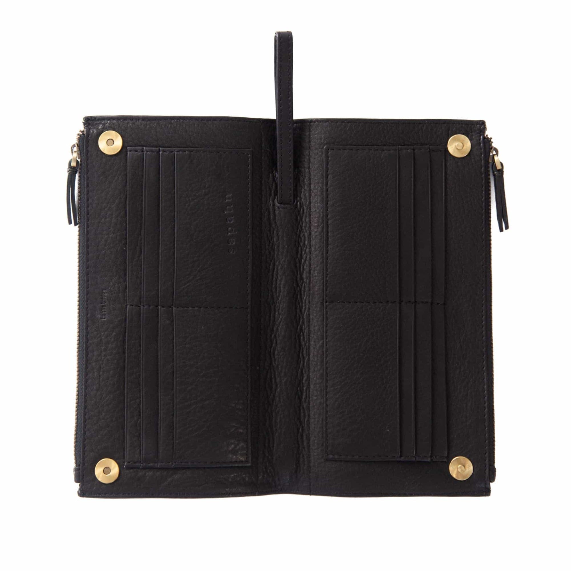 Lay the Parker deluxe wristlet wallet in black raw leather flat to see all 16 card slots at once.