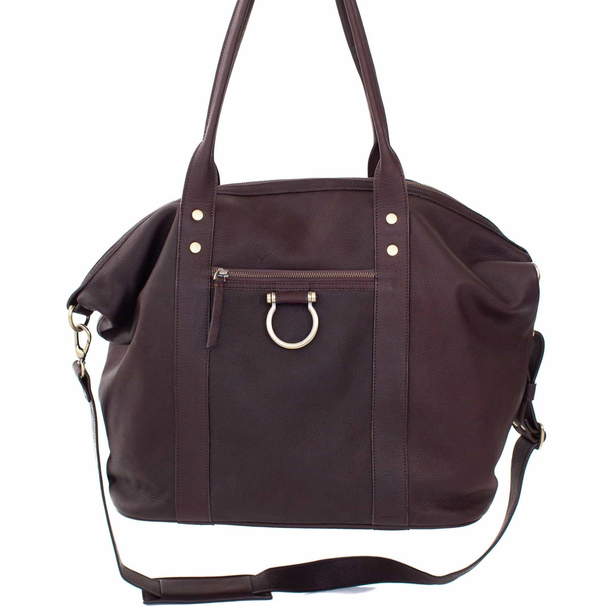 The So Honey weekender in chocolate brown raw leather is the perfect tote bag for travel and everyday use with a large main compartment.